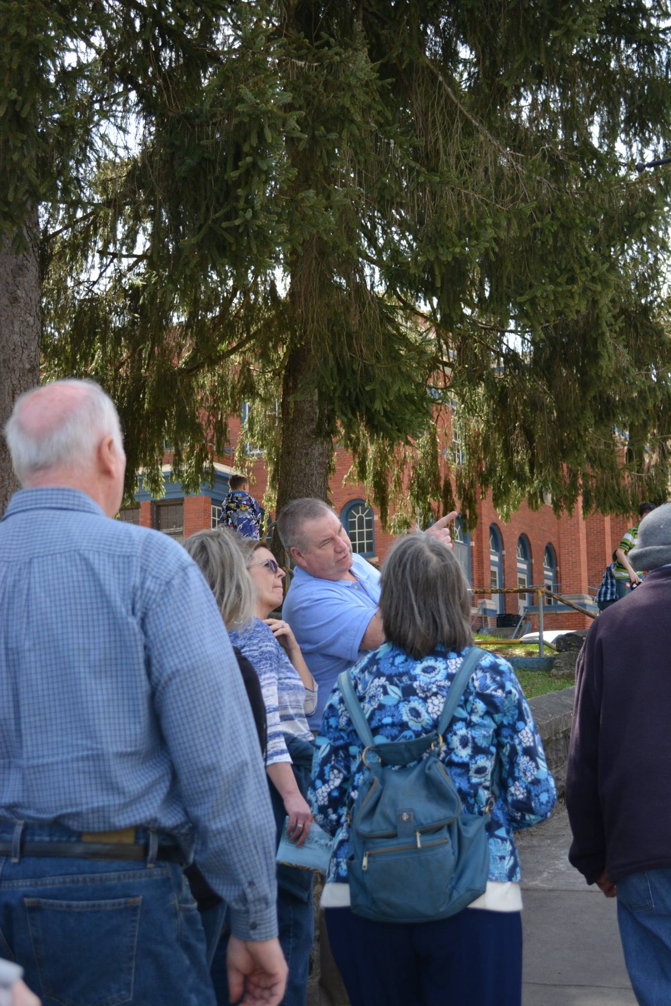 Historic walking tour group exploring Mount Hope architecture